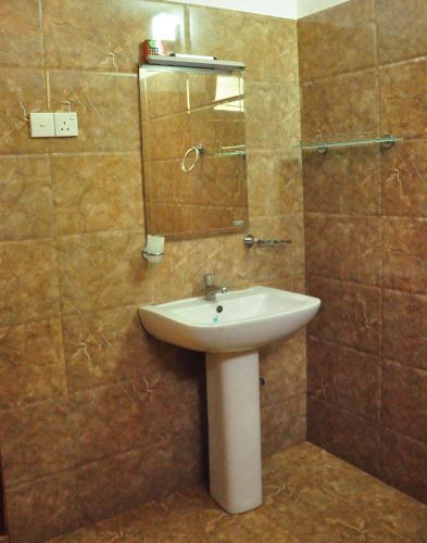 a bathroom with a sink and a mirror at Thal Sewana in Sigiriya