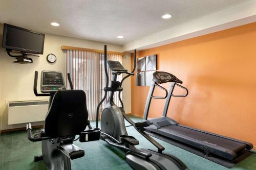 a room with a gym with a treadmill and a exercise bike at Travelodge Suites by Wyndham New Glasgow in New Glasgow