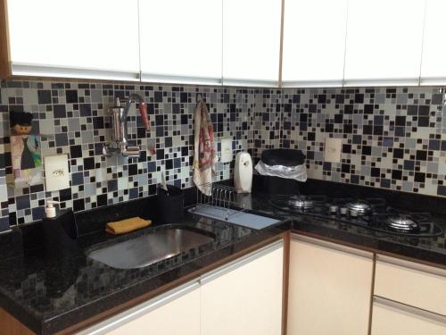 a kitchen with a sink and a counter top at VIP Copacabana Beach in Rio de Janeiro