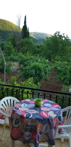 a table with a green bowl on top of it at Toulatos Pantelis in Pouláta