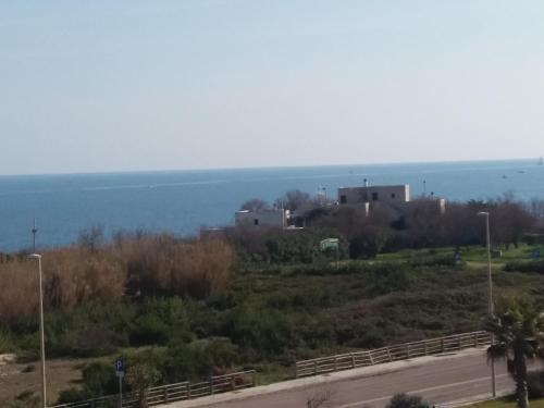 a view of the ocean from a road at Bilocale Punta Rosa - Fronte Spiaggia in Otranto