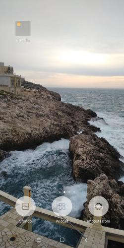 a view of the ocean from a balcony at B&B Alicino in Cerfignano
