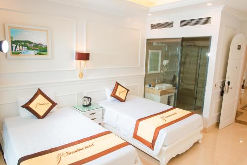 Ένα ή περισσότερα κρεβάτια σε δωμάτιο στο PARADISE HOTEL
