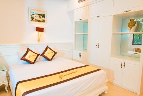 Ένα ή περισσότερα κρεβάτια σε δωμάτιο στο PARADISE HOTEL