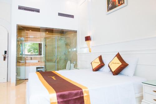 Ένα ή περισσότερα κρεβάτια σε δωμάτιο στο PARADISE HOTEL