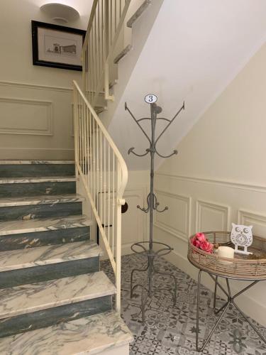 a staircase in a house with a basket on the floor at B&B ALVINO in Bientina