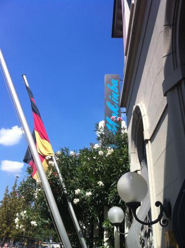 a building with a flag in front of a building at Mokinba Hotels Montebianco in Milan