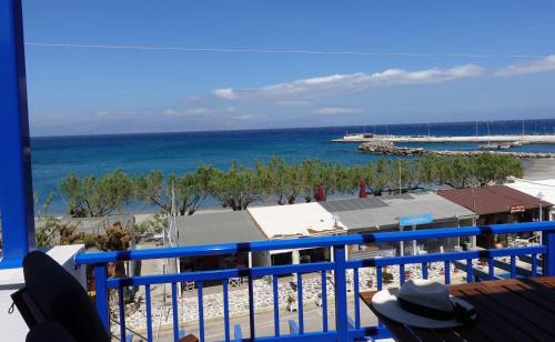 a balcony with a view of the beach and the ocean at Sea Urchin Apartments 2nd floor in Agia Pelagia Kythira
