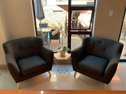 Un lugar para sentarse en Hotel AT Hatfield Apartments