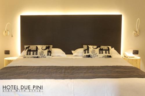 Postel nebo postele na pokoji v ubytování Hotel Due Pini