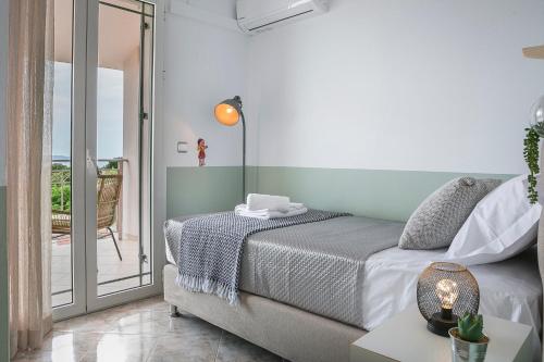 Tempat tidur dalam kamar di Villa Alessandra