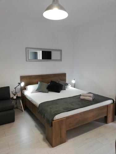a bedroom with a large bed in a room at APARTMANI NOVA in Živogošće