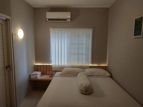 Ένα ή περισσότερα κρεβάτια σε δωμάτιο στο Samami Garden
