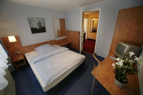 Postel nebo postele na pokoji v ubytování Hotel Altes Rathaus