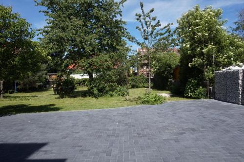 a brick driveway with trees in the background at Ferienhaus Hundertmorgenfeld 33 in Wernigerode