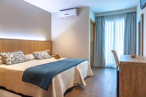 Postel nebo postele na pokoji v ubytování Hotel Turimar