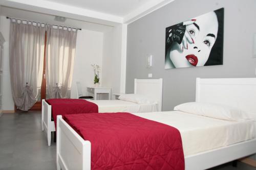 Cama o camas de una habitación en Bed & Breakfast Nettuno