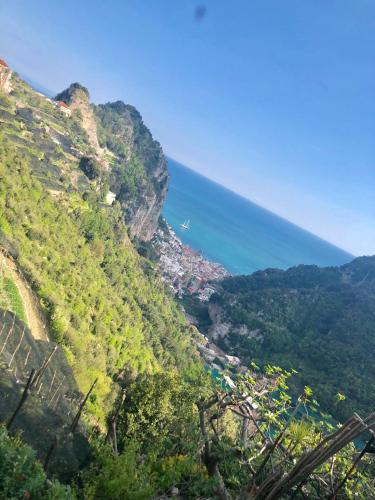 a view of a mountain with the ocean in the background at Sky House Amalfi Coast in Scala