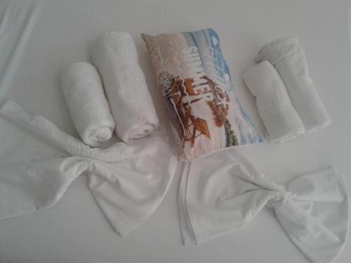 a group of towels and a package of toothpaste at Art Studios Benitses in Benitses