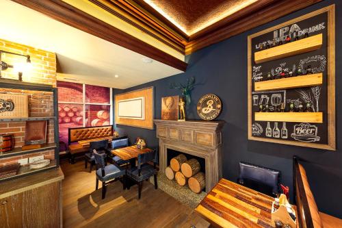 a restaurant with a fireplace and a table and chairs at Citymax Hotel Al Barsha in Dubai