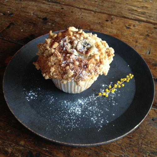 a muffin sitting on a plate on a table at Mt Fuji Historical Oshi house hitsuki in Fujiyoshida