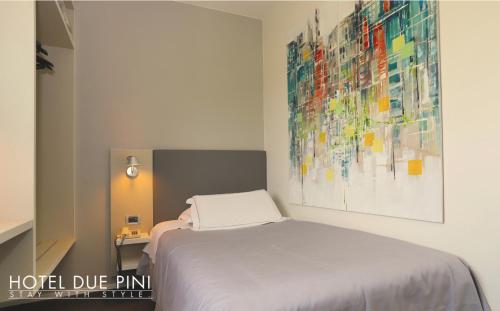 Postel nebo postele na pokoji v ubytování Hotel Due Pini