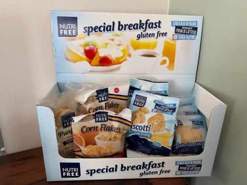 a refrigerator filled with different types of breakfast food at Porta Ronca - B&B, Suites & Apts in Rho