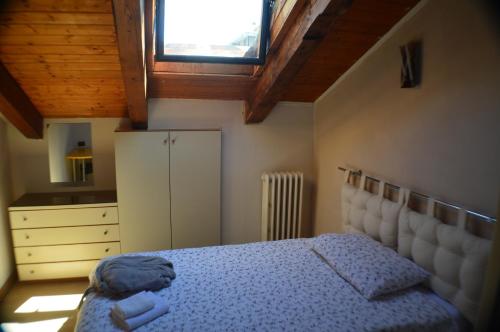 Ein Bett oder Betten in einem Zimmer der Unterkunft Appartamento Mara