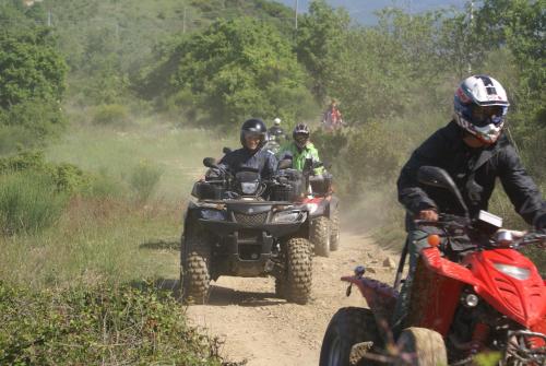 a group of people riding atvs on a dirt road at La Casa Di Campagna in Magione