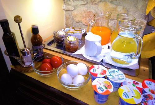 a counter with eggs and other ingredients on it at Il Castello in Petralia Sottana