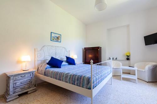 a bedroom with a bed and a dresser at Villa Beatrice in Sorrento