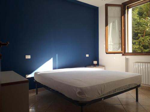מיטה או מיטות בחדר ב-Livi Patrik