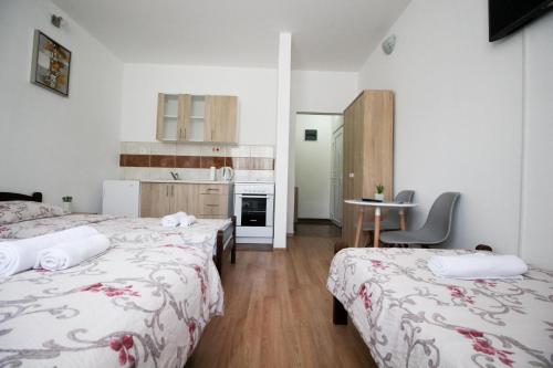 Postel nebo postele na pokoji v ubytování Apartments Station
