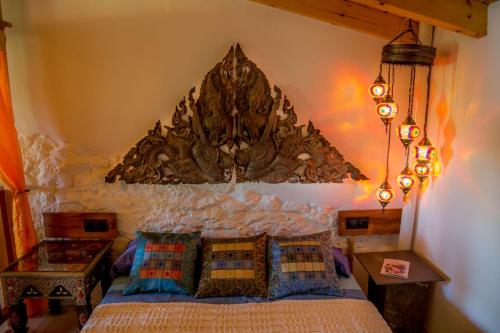 En eller flere senge i et værelse på Casa con encanto en Alájar