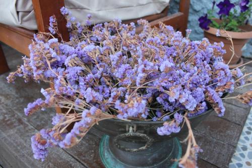 a bouquet of purple flowers in a vase on a table at Macide Hanım Konağı in Ayvalık