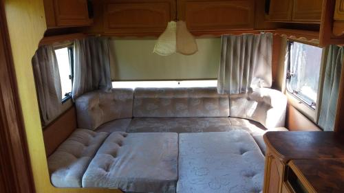 a small bed in the back of an rv at Gaišie in Jūrmalciems