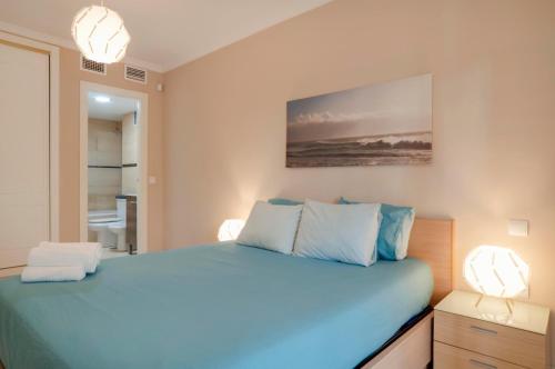 Posteľ alebo postele v izbe v ubytovaní Beach and golf apartament