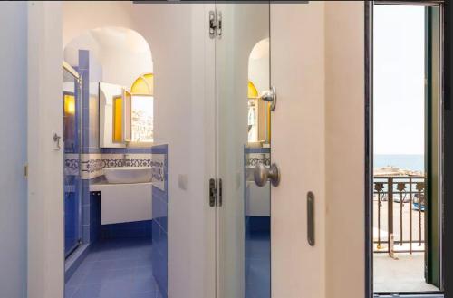 a bathroom with a sink and a mirror at Il Pennello in Amalfi