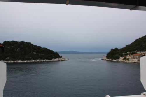 a view of a body of water from a window at Guesthouse Santor in Lastovo