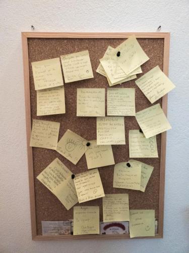 a bulletin board filled with lots of sticky notes at Su 'e Torigheddu - Casa con terrazza panoramica in Cuglieri