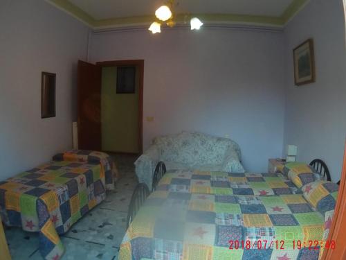Letto o letti in una camera di The Caponi Bros