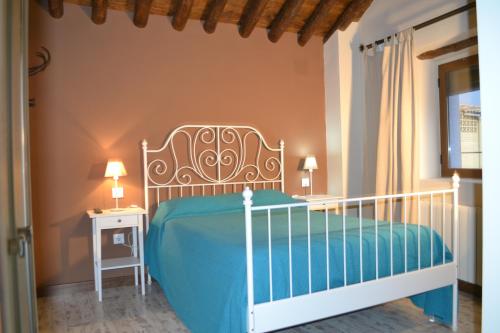 a bedroom with a bed and a table and a window at El Pajar de la Abuela in Arcas