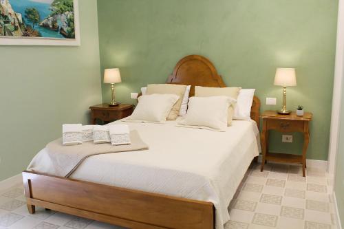 a bedroom with a large bed with two night stands at Estlevante B&B in Vieste