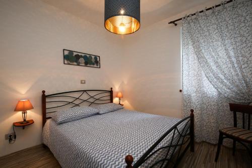 Ένα ή περισσότερα κρεβάτια σε δωμάτιο στο Apartments Fiora