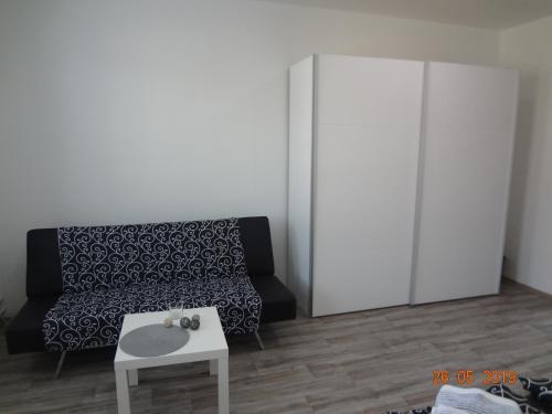 a living room with a couch and a table at Apartmány U splavu in Veselí nad Moravou