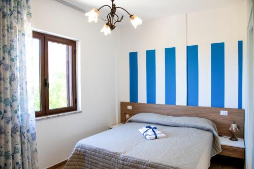 Posteľ alebo postele v izbe v ubytovaní b&b binario nove e tre quarti