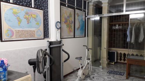 a room with a map of the world on the wall at Homestay Nam Dong in Hanoi