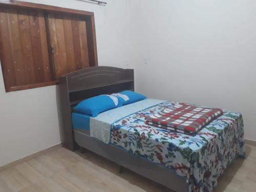 Ένα ή περισσότερα κρεβάτια σε δωμάτιο στο suites montanha das letras