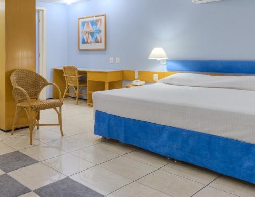 Кровать или кровати в номере Iate Plaza Hotel