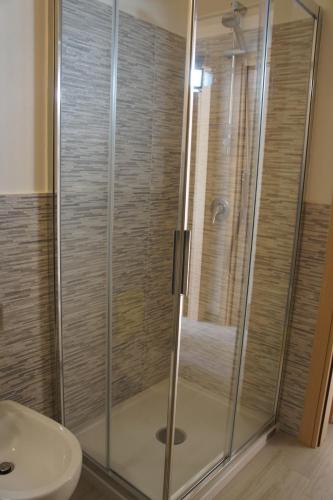 a bathroom with a shower and a sink at Apartment Mistral in Badesi